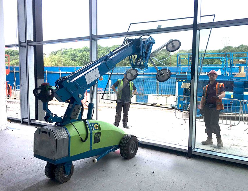 Winlet glazing robot installing sheet of glass